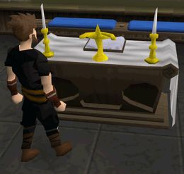 File:Praying at altar.gif