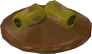 File:Reinald's Smithing Emporium Gold armguards stand.png