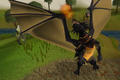 The dragon in the trimmed cape's emote is gilded, like the trimmed cape itself.