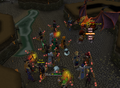 Players fighting a Party Demon in Varrock Sewers