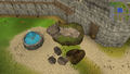 The fallen rocks in the Lumbridge castle courtyard. They block access to the door of the north castle tower.